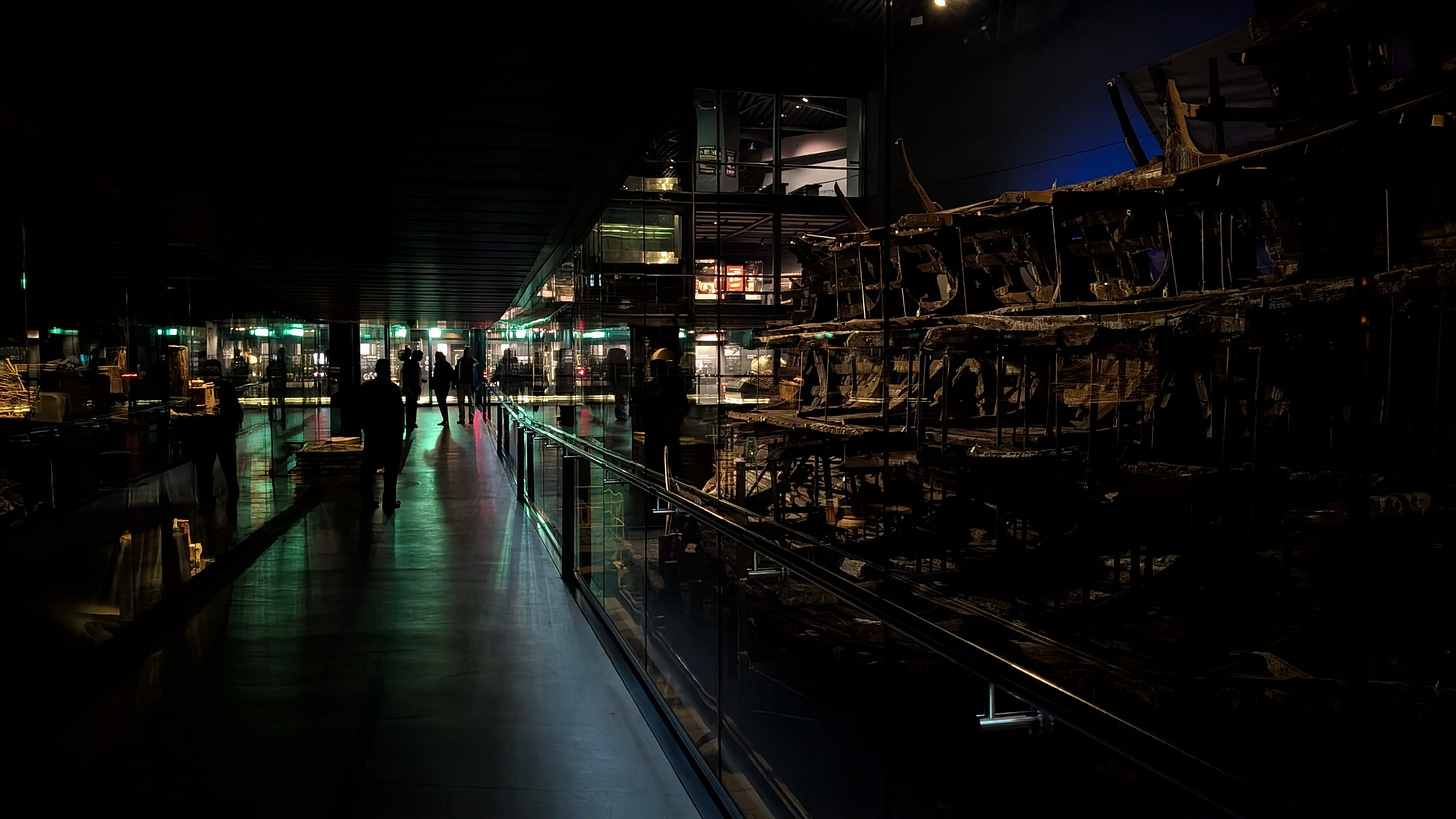 A dark picture of the gallery walkway with the ship on the right hand side.