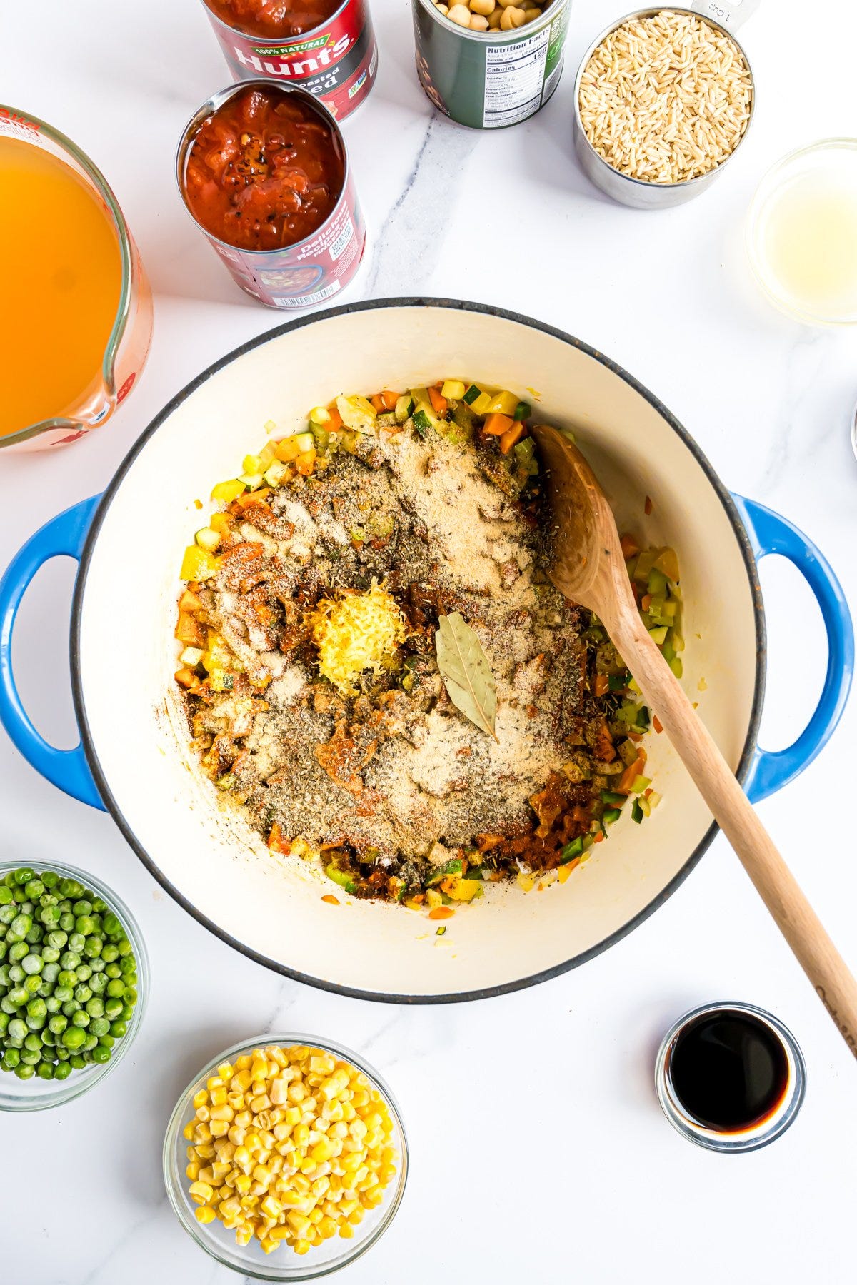 A large Dutch oven with the veggies and spices for the soup.