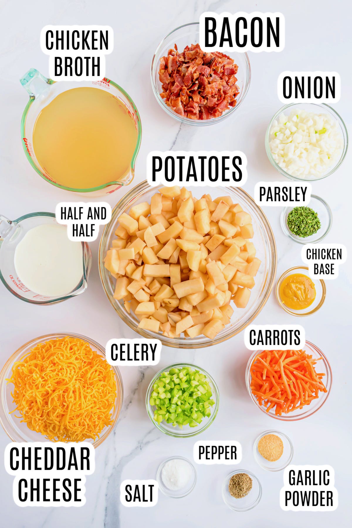 The ingredients needed to make the Easy Loaded Baked Potato Soup Recipe include: chicken broth, bacon, onion, half and half, potatoes, parsley, chicken base, carrots, celery, cheddar cheese, salt, pepper and garlic powder.