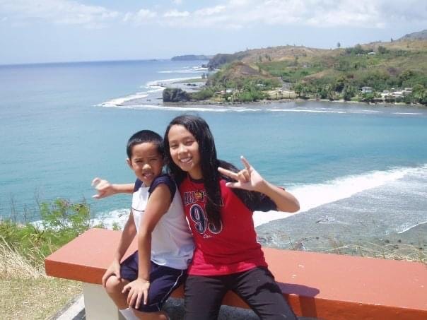 Kids in Guam, ocean in the background