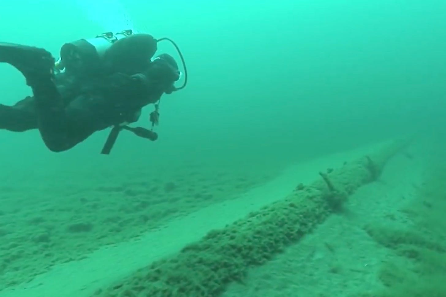 A National Wildlife Federation diver inspects Enbridge’s Line 5 pipeline at the bottom of the Straits of Mackinac. Credit: National Wildlife Federation video screenshot