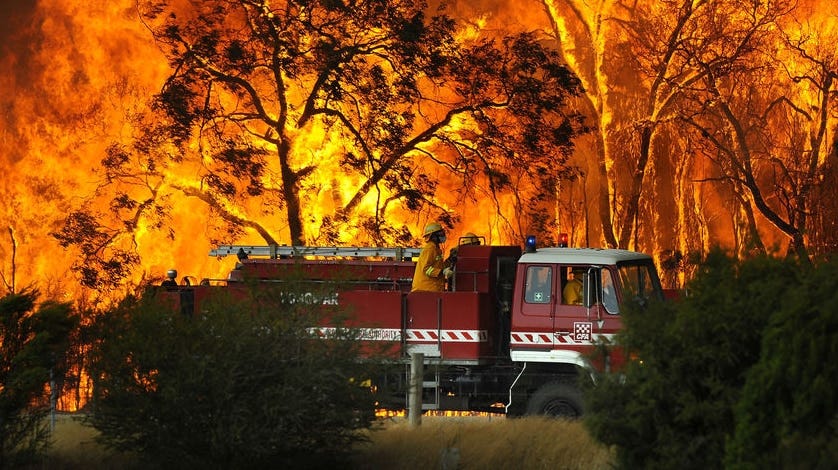 A Country Fire Authority truck is pictured in front of flames while fighting a Bunyip bushfire