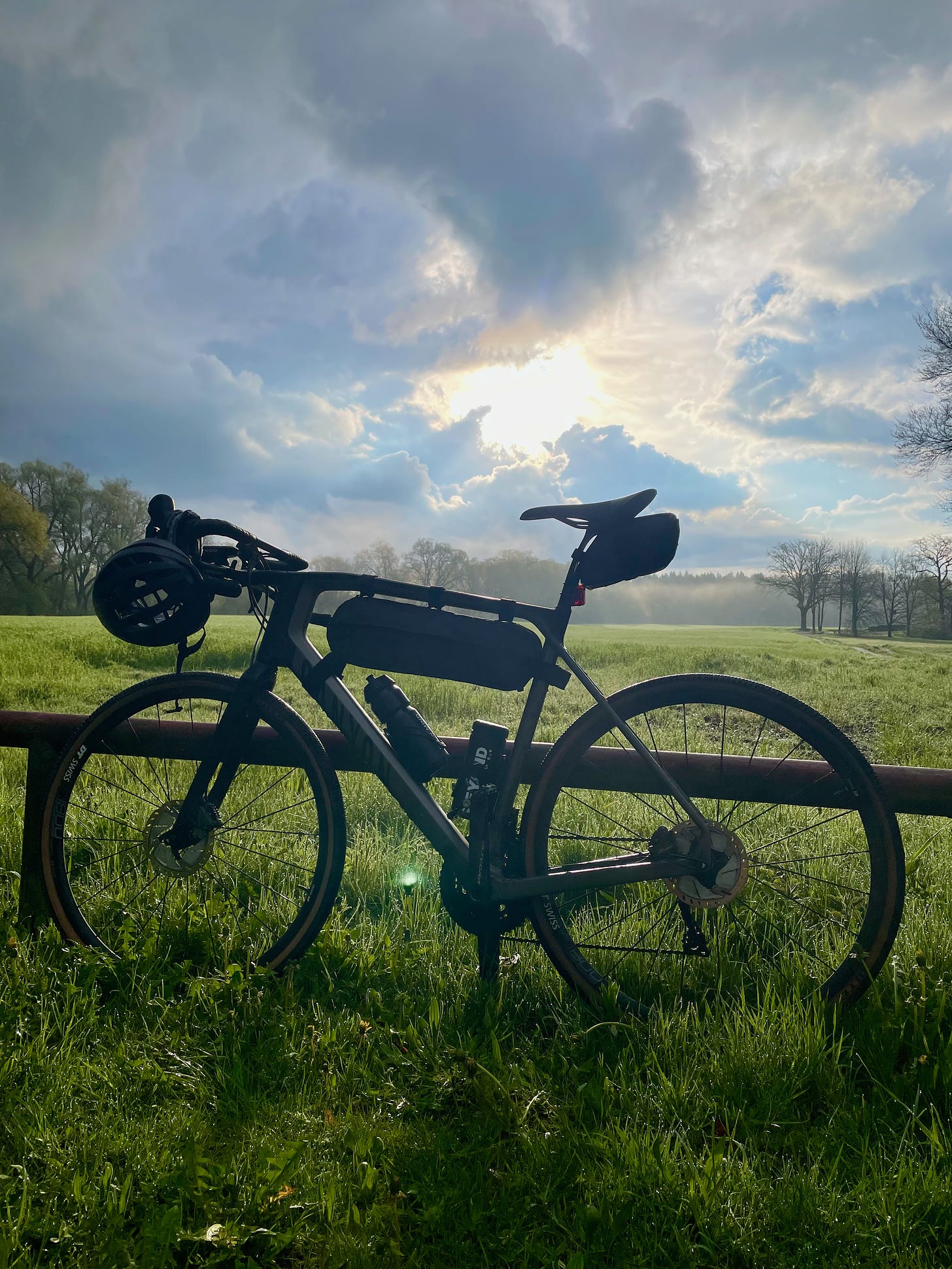 Photo of the authors gravel bike with a wide nature landscape in the background