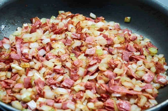 chopped bacon and onions in pan