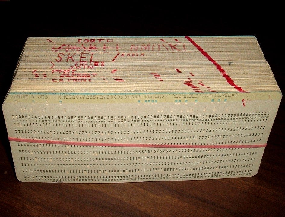 A stack of rubber banded punch cards