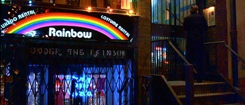 The name of the store where Bill rents his elite ritual costume: "Rainbow". The name of the store under it: "Under the Rainbow". 