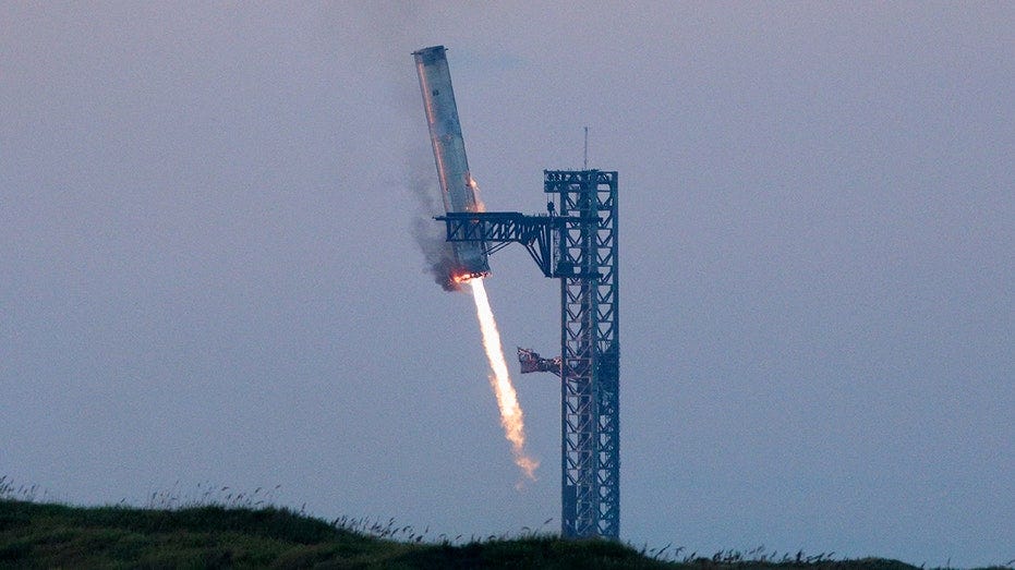 Elon Musk's SpaceX successfully catches returning booster with mechanical  arms | Fox Business