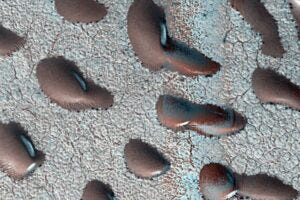 Surrounded by frost, these Martian dunes in Mars northern hemisphere were captured from above by NASAs Mars Reconnaissance Orbiter using its HiRISE camera on Sept. 8, 2022. Credit: NASA/JPL-Caltech/University of Arizona