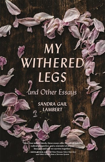 A book cover has an image of pink flower pedals are starting to dry and crumple on a wood surface, forming a circle around the book’s title.
