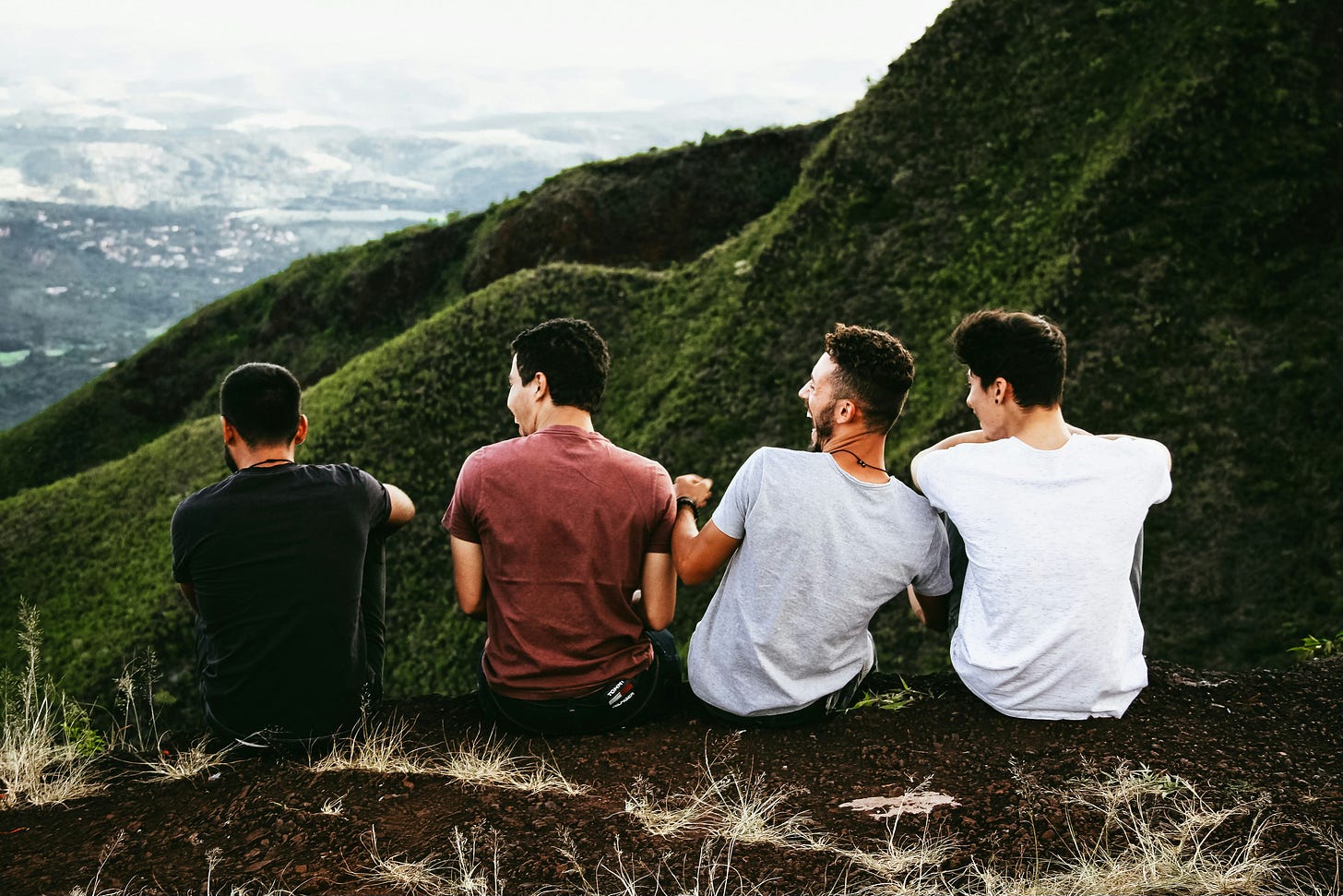 male friends sitting together male friends sitting together