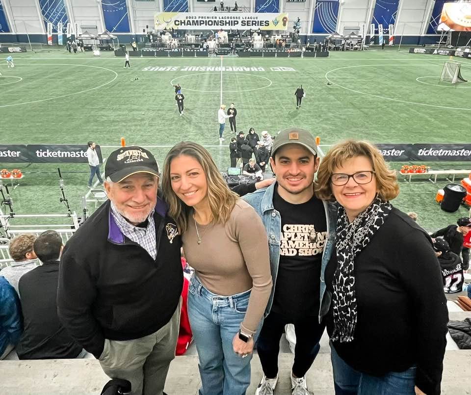 May be an image of 6 people, people standing, outdoors and stadium