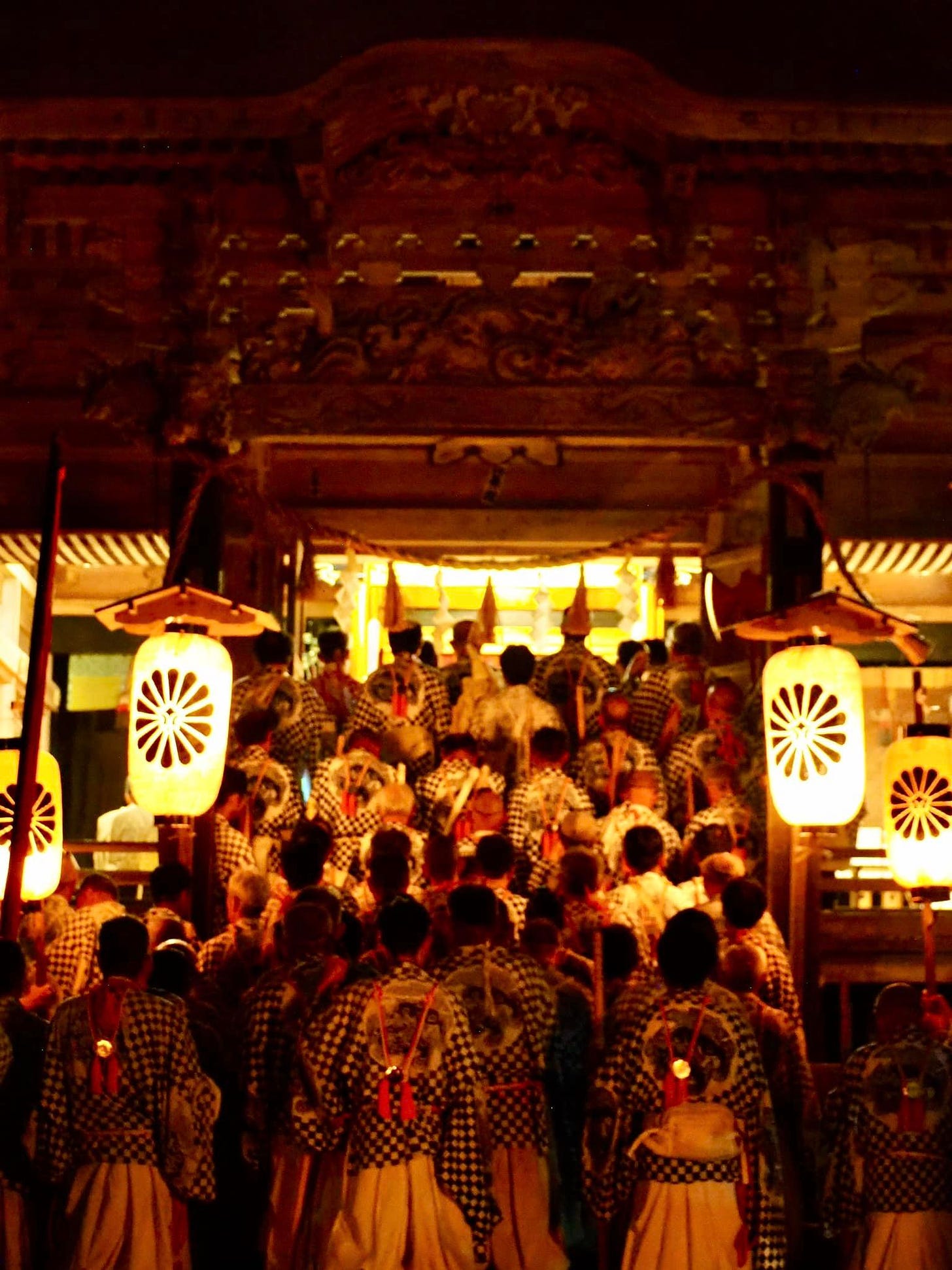 May be an image of 2 people, crowd and Fushimi Inari Taisha