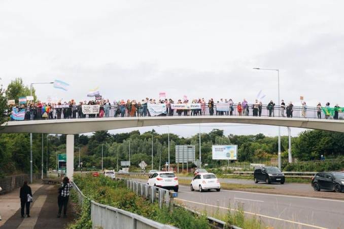 A group of people on a bridge AI-generated content may be incorrect. A group of people on a bridge AI-generated content may be incorrect.