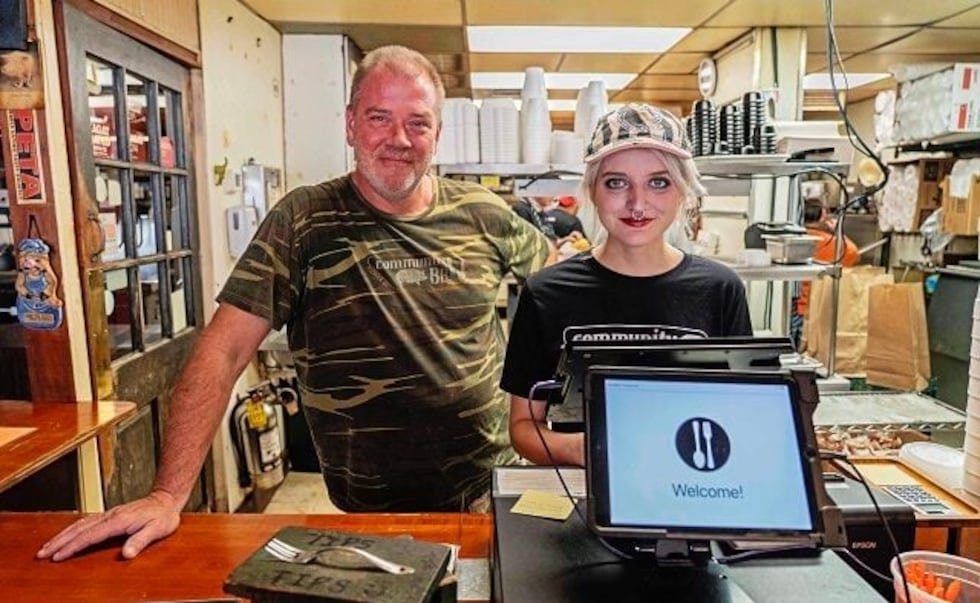 Community Q co-owner, Dave Roberts, left, with Sadie Ellers, an employee at the restaurant.