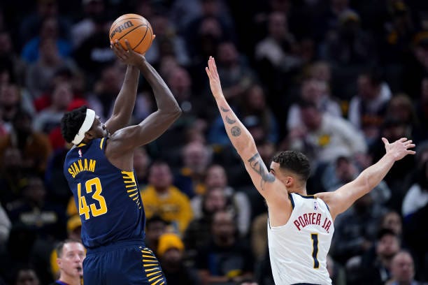 Pascal Siakam of the Indiana Pacers attempts a shot while being guarded by Michael Porter Jr. #1 of the Denver Nuggets in the first quarter at...