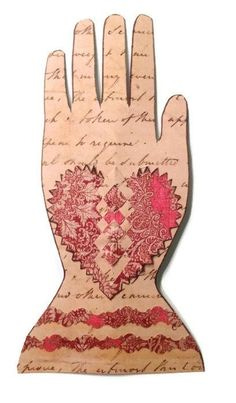This may contain: a hand that has been made out of wood with writing on it and a heart in the middle