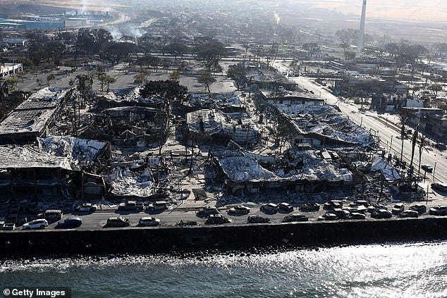 The historic town of Lahaina, which is in Maui County, has suffered black after block of complete devastation from the wildfires; an aerial view shows charred cars demolished buildings on Friday