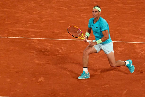 Rafael Nadal of Spain plays a backhand during his Men's single first round match against Alexander Zverev on Day Two of the 2024 French Open at...