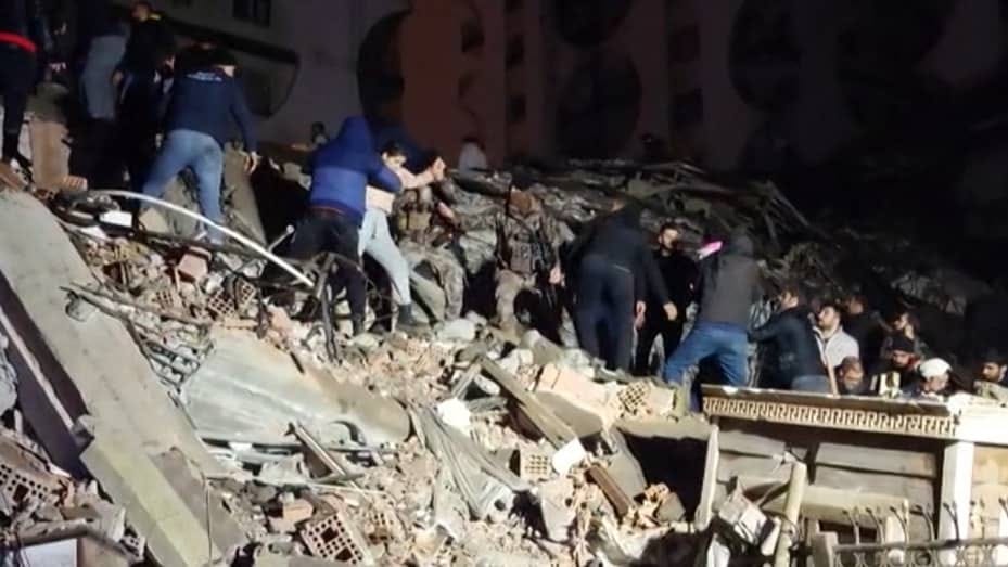Rescuers search for victims of a 7.8-magnitude earthquake that hit Diyarbakir, Turkey, in this video grab from AFP taken Feb. 6, 2023.
