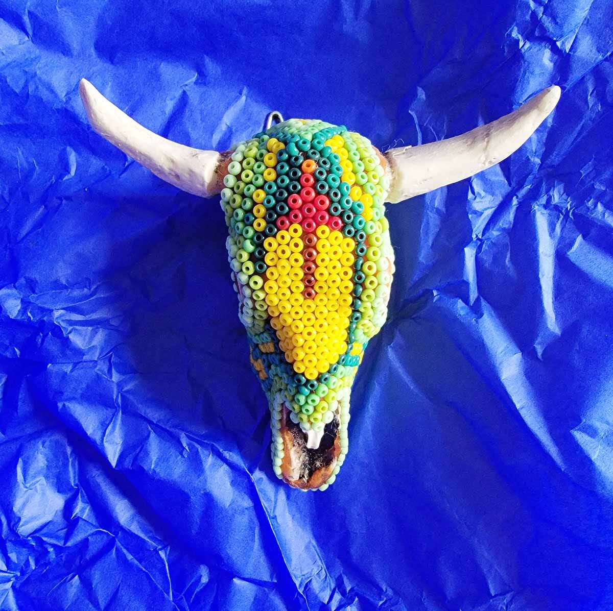 A Huichol beadwork cow skull. 