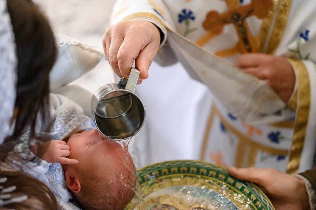 Moments of baptism of the child in the temple of God, Christian traditions, sanctification of the child with water. - Photo, Image
