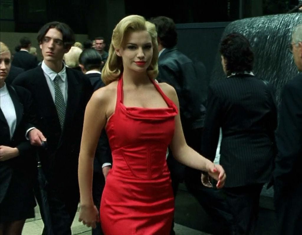 The Woman in Red shown in the Matrix was more than just a distraction. Red  is considered the opposite colour of Green (the tint and theme of the  matrix) so she stands