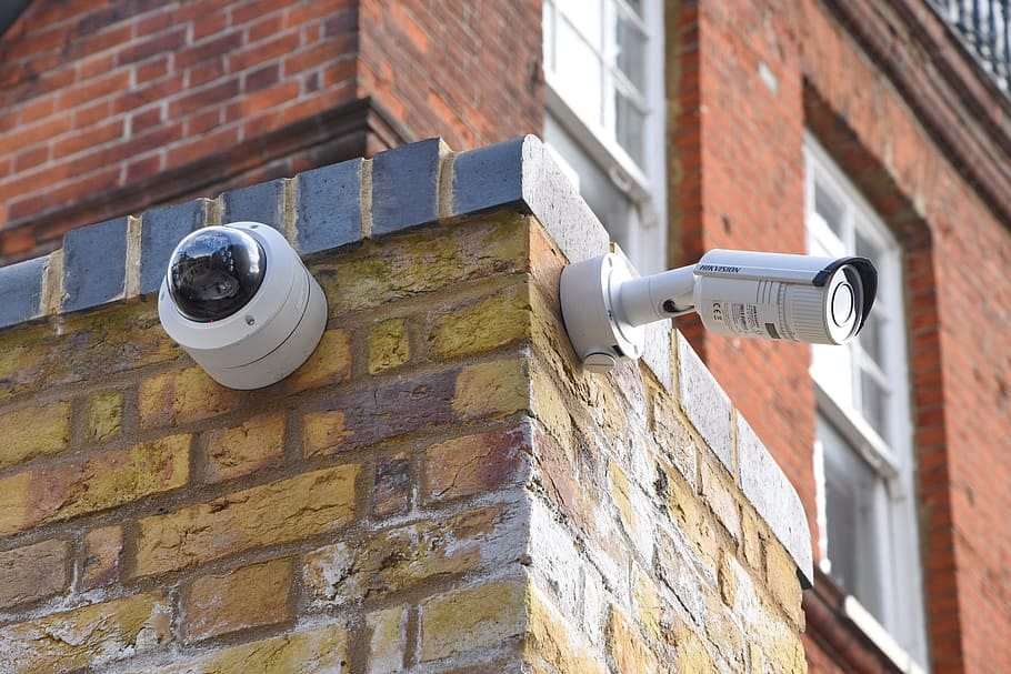 two, white, assorted-type wall, mounted, security cameras, brown, brick wall, cctv, camera, security, surveillance two, white, assorted-type wall, mounted, security cameras, brown, brick wall, cctv, camera, security, surveillance