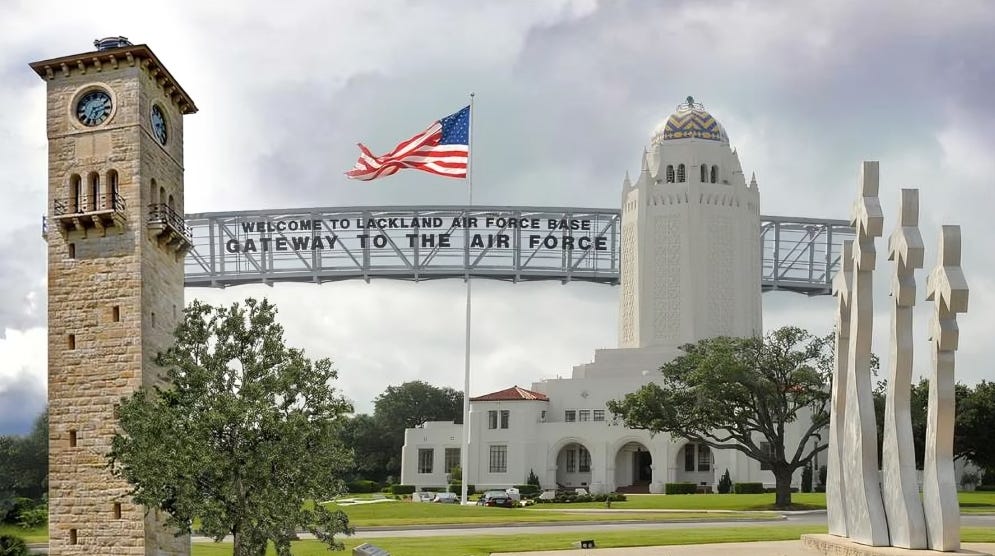 Iconic entrance and landmarks of Joint Base San Antonio-Lackland, where security forces recently thwarted a drive-by shooting targeting the base's gate, showcasing the importance of military defense readiness.