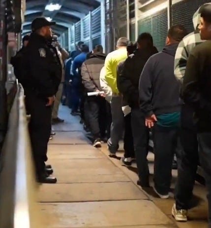 US CBP Officer watches over migrants being removed from the USA and returning to their home countries.