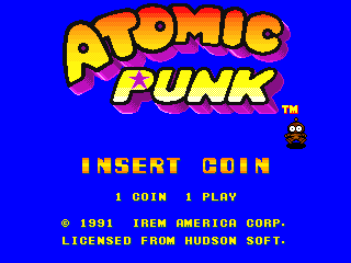 The title screen for the North American release of Bomberman's first arcade game, known as Atomic Punk in the region. It shows the game's logo, a blown-up Bomberman with wide white eyes, and the licensing info at the bottom.