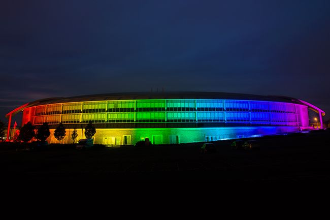 GCHQ building lit in LGBTQ rainbow colors