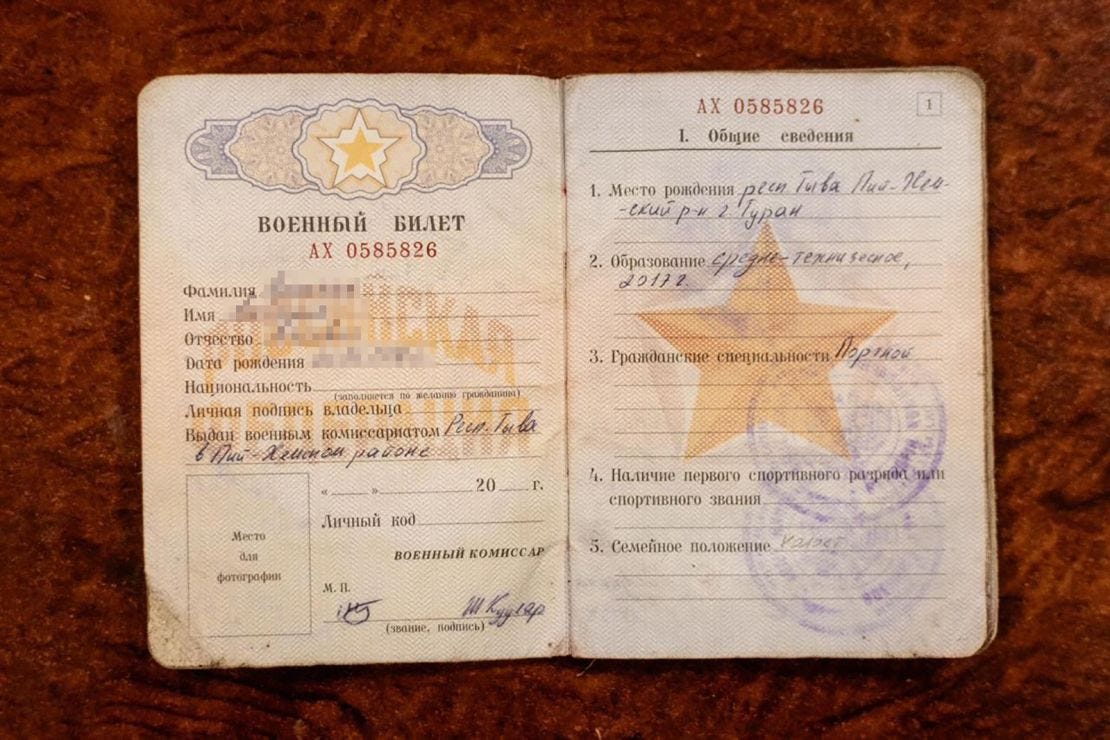 A video and still photograph show a Russian military ID which Ukraine claims was carried by a North Korean soldier taken captive by Ukrainian forces. CNN has blurred the name and date of birth on the ID. A video and still photograph show a Russian military ID which Ukraine claims was carried by a North Korean soldier taken captive by Ukrainian forces. CNN has blurred the name and date of birth on the ID.