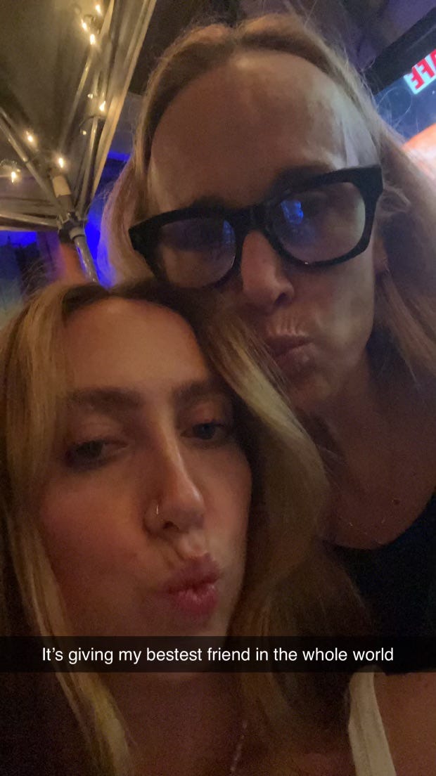 mother and daughter making fish faces in a selfie