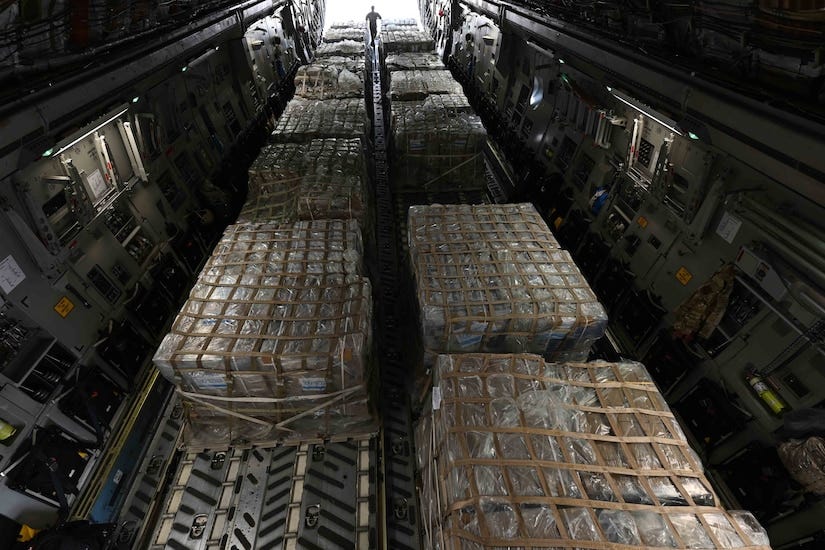 Cargo is loaded in an aircraft.