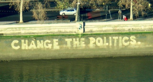 Graffiti that says Change The Politics