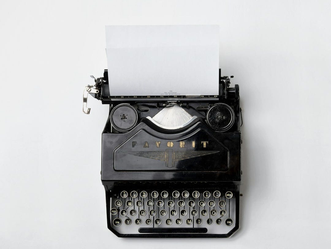 black Fayorit typewriter with printer paper black Fayorit typewriter with printer paper