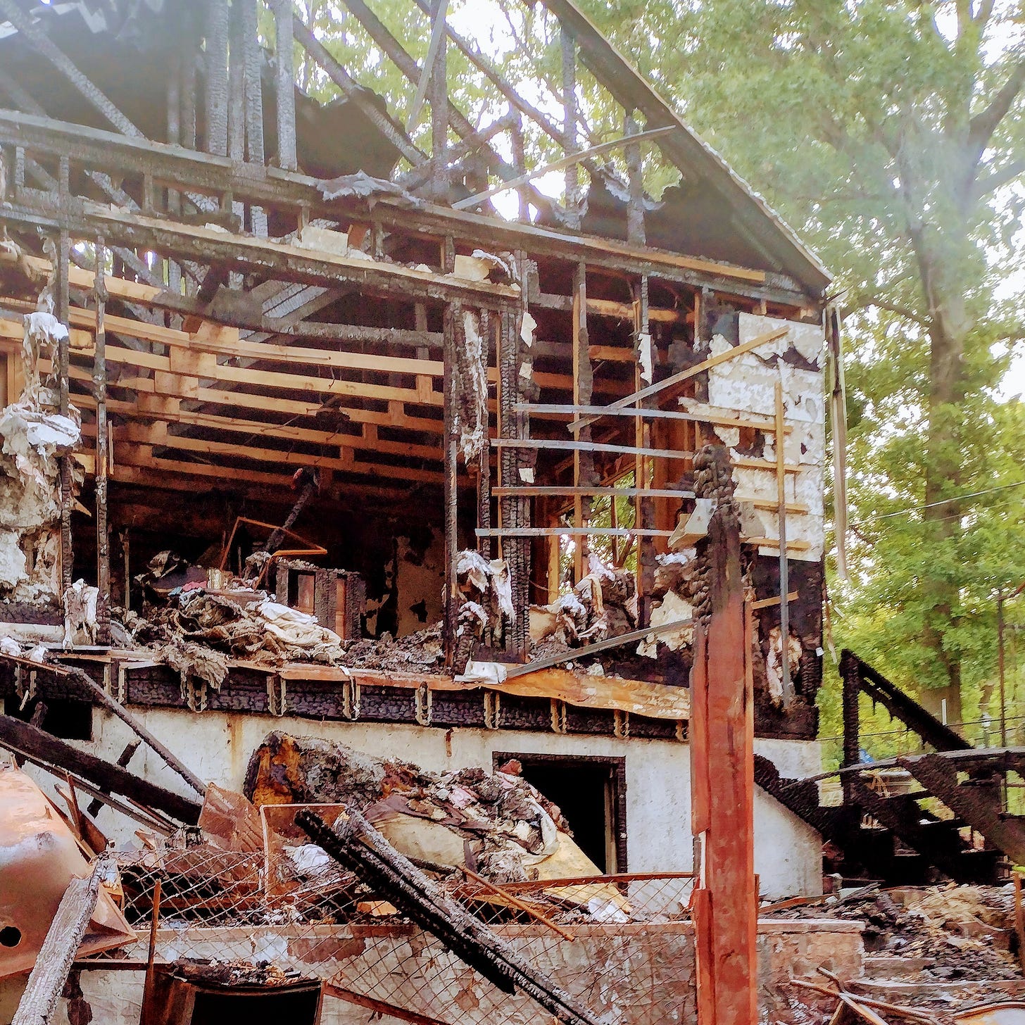 Back of house, showing burnt room.