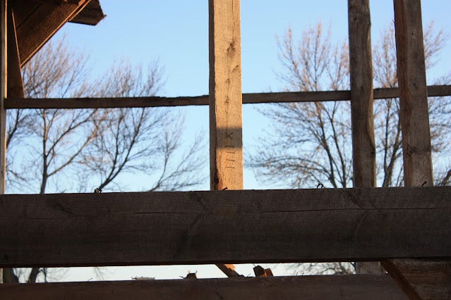 markings on a beam inside the barn