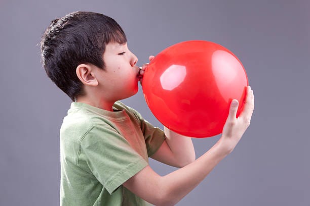 710+ Child Inflating Balloon Stock Photos, Pictures & Royalty-Free Images -  iStock