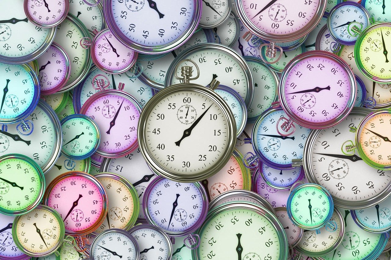 A pile of colourful clocks