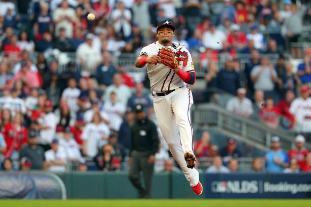 Orlando Arcia of the Atlanta Braves throws to first base for an out in the second inning against the Philadelphia Phillies during Game Two of the...