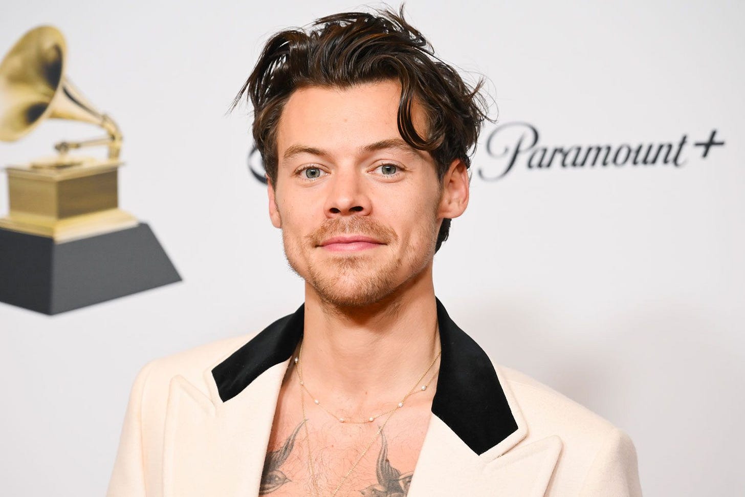 Harry Styles poses with his GRAMMY awards for Best Pop Vocal Album and Album of the Year for Harrys House in the Press Room at the 65th Annual GRAMMY Awards held at Crypto.com Arena on February 5, 2023