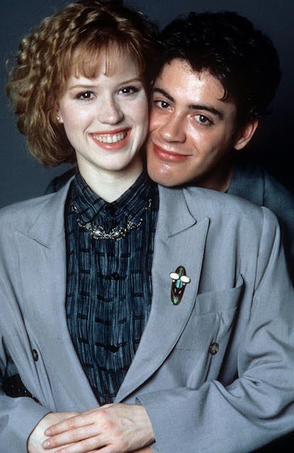 A publicity shot from the film The Pick Up Artist showing the lead couple in an awkward embrace.