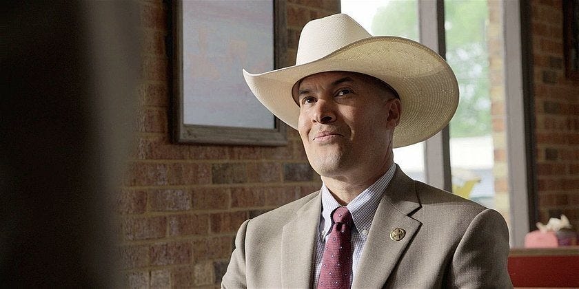 Walker James Coby Bell in Texas Rangers white hat.