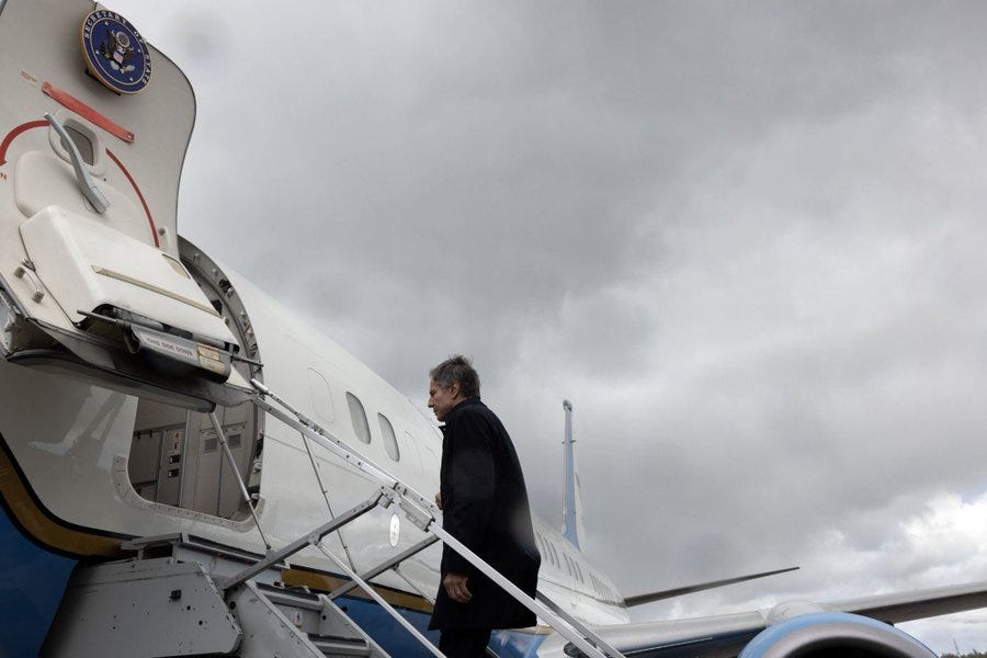 Secretary of State Antony Blinken walks up the stairs to his official plane while leaving Helsinki.