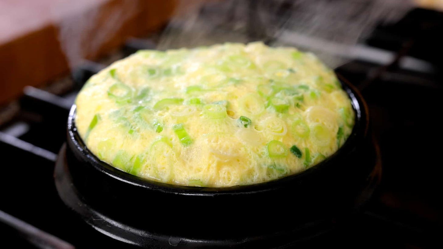 Steamed eggs in an earthenware bowl (Ttukbaegi gyeranjjim) recipe by  Maangchi