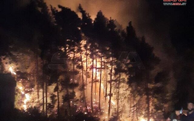 A fire sparked by an alleged Israeli strike in the Masyaf area of central Syria, late September 8, 2024. (SANA)