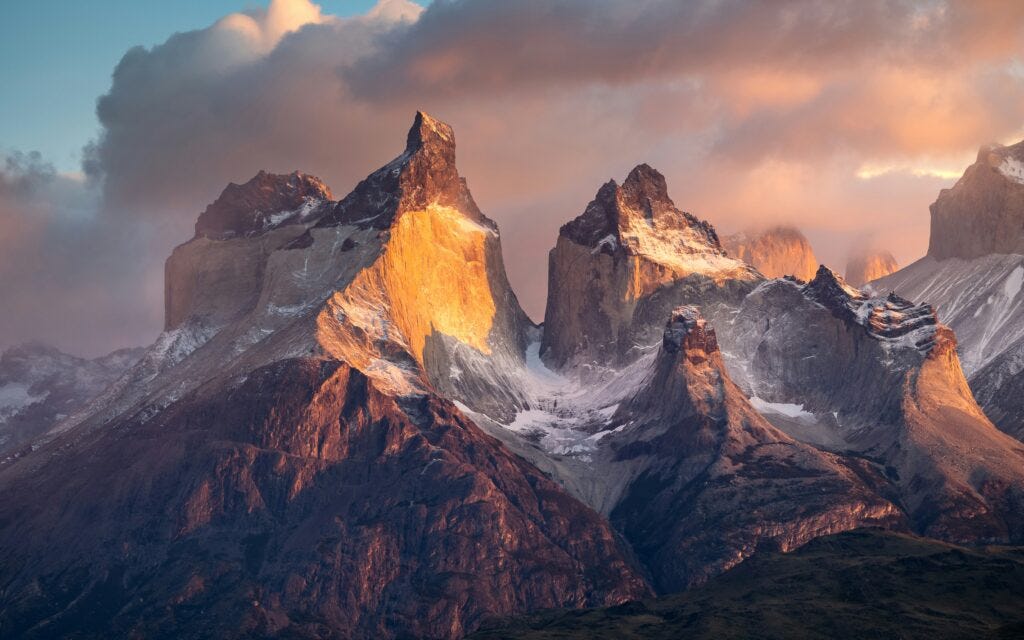 "Sunrise" An epic view of Torres del Paine. In the early morning, when conditions are just right, the first sunlight beautifully highlights parts of the mountains.