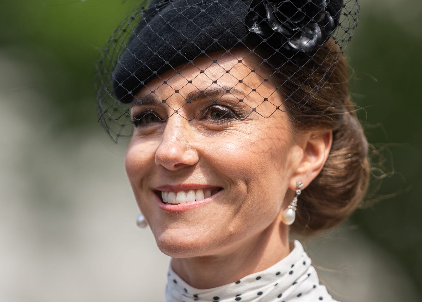 Princess of Wales wearing veiled hat and polka dot dress