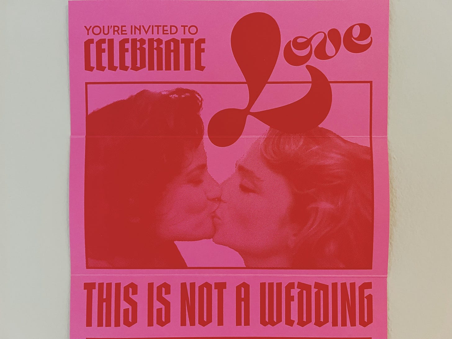 A pink and red invitation to the love party, with two women kissing